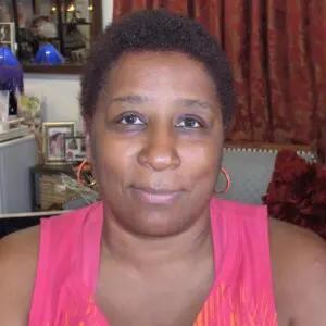 A woman in a pink top.