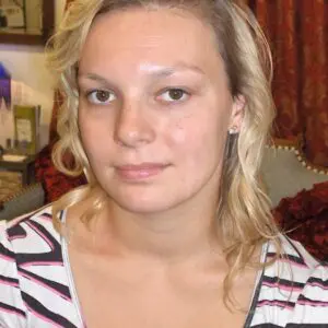 A woman wearing a striped shirt.