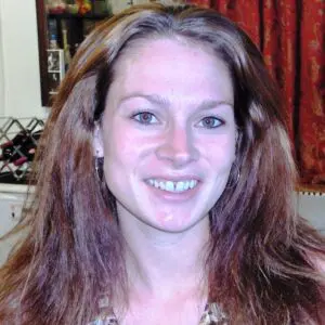 A woman wearing a leopard print top.