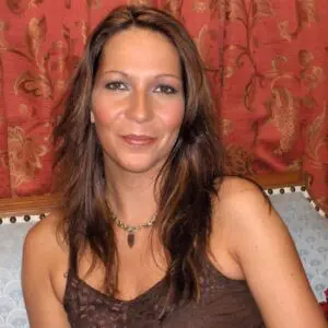 A woman sitting on a couch.