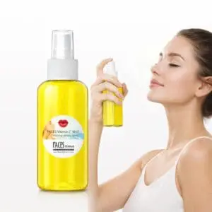 Woman using vitamin C facial mist spray.