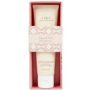 A tube of Farmhouse Fresh Sweet Tea Shea Butter Hand Cream in a pink box.