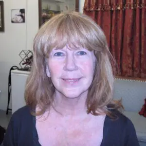 A woman wearing a black top.