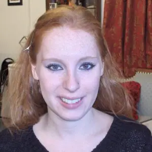 A woman wearing a black sweater.