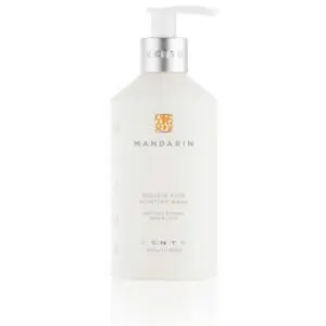 A bottle of hand and body lotion on a white background.
