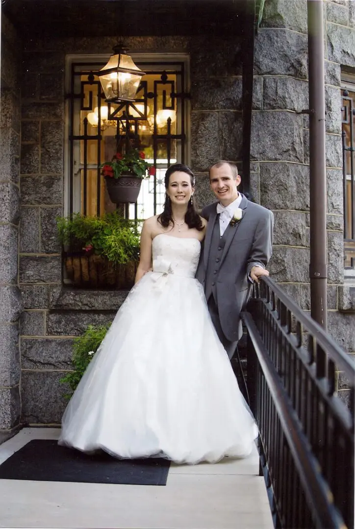 Bride and groom pose for wedding photo.