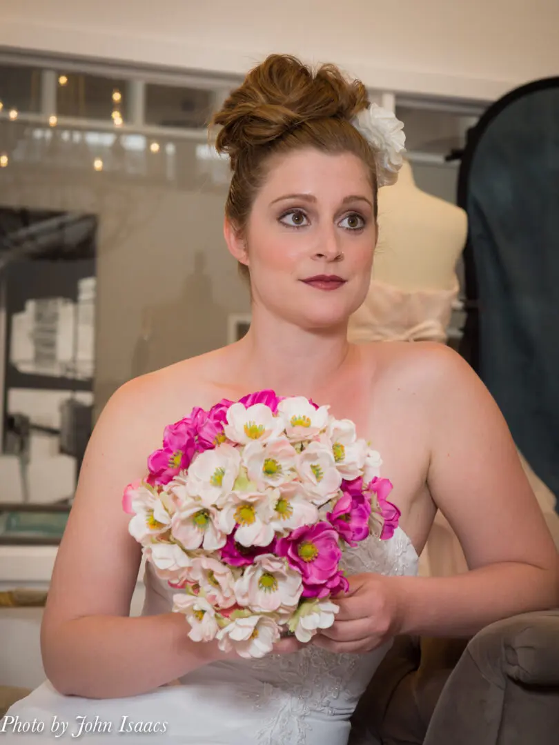 Bride holding pink and white bouquet.