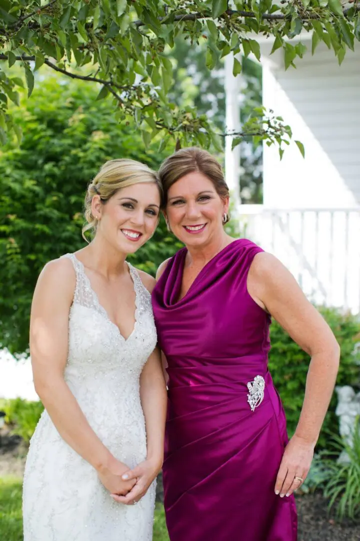 Bride and mother posing for a photo.