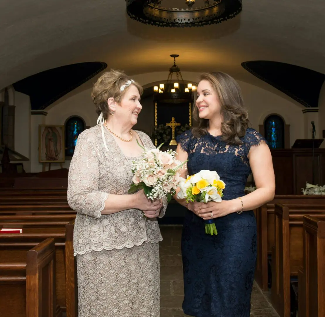 Mother and daughter at wedding ceremony.