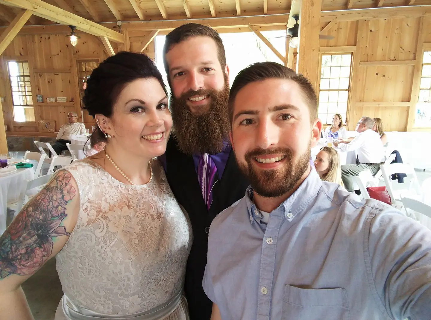 Wedding selfie with bride and groom.
