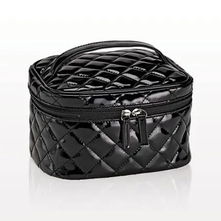 Quilted black cosmetic bag with zipper.