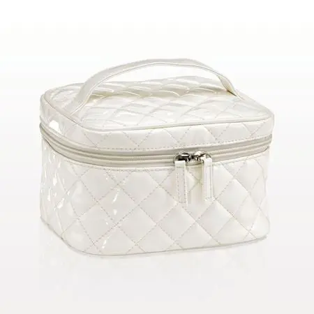White quilted cosmetic bag with handle.