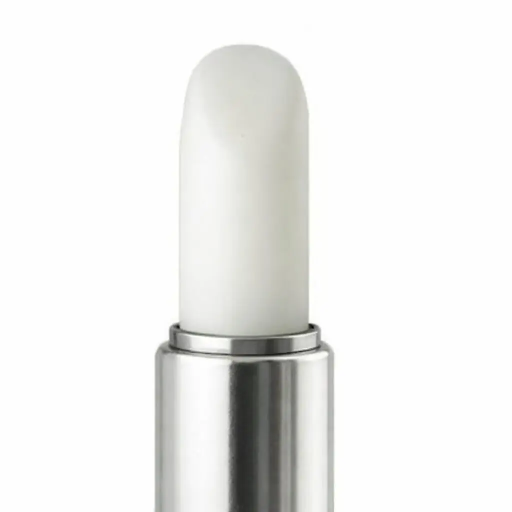 White lipstick in silver tube, close-up.