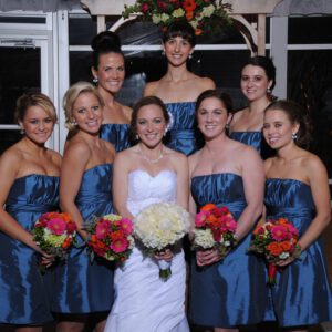 A group of bridesmaids posing for a picture.