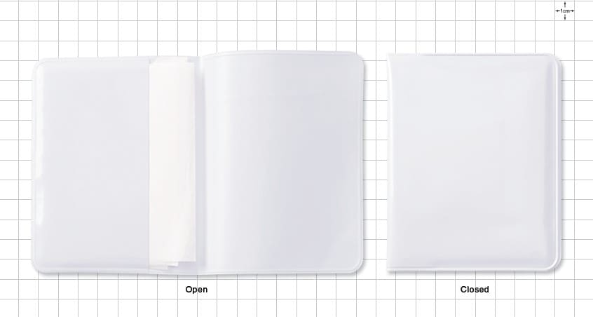 Open and closed white notebooks on grid.