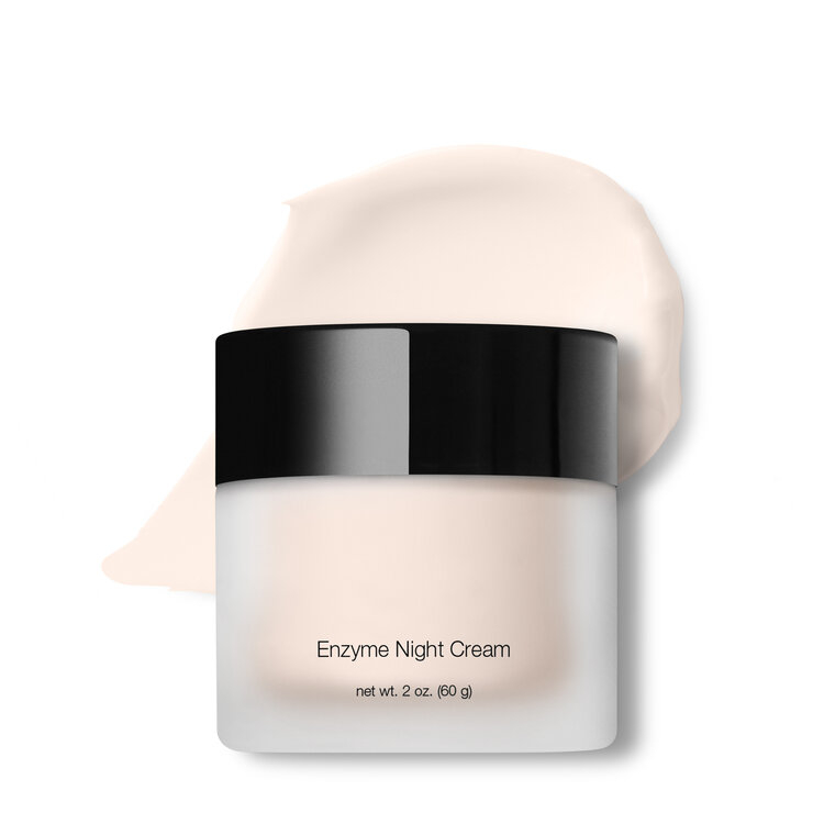 A jar of enzyme night cream on a white background.