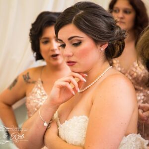 A bride getting ready with her bridesmaids.