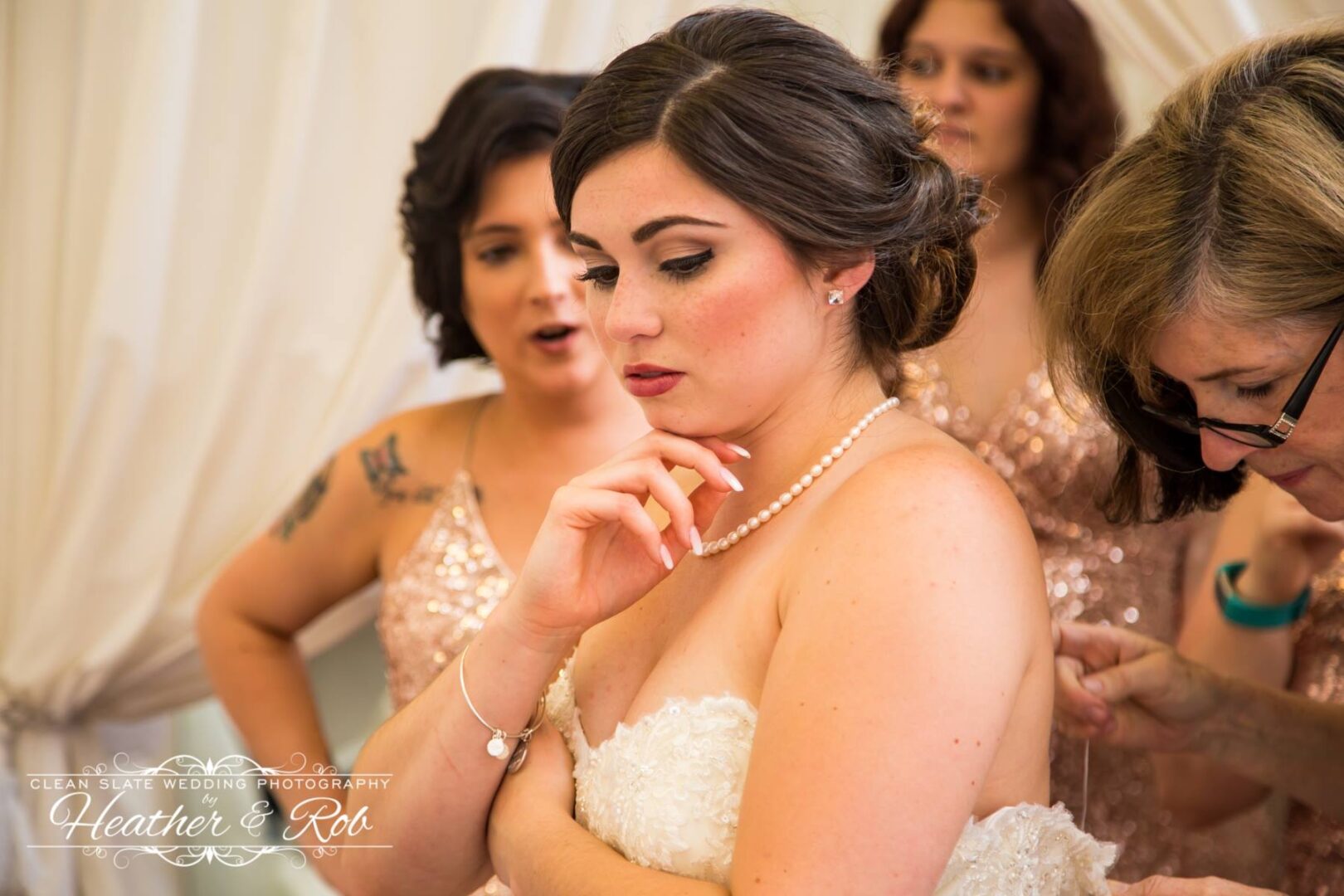 A bride getting ready with her bridesmaids.