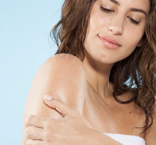 A woman with a towel on her arm.