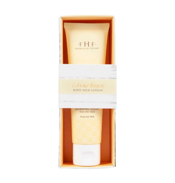 A tube of Farmhouse Fresh Citrine Beach Body Milk Hand Lotion in a white box.