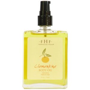 A bottle of Farmhouse Fresh Clementine Body Oil on a white background.