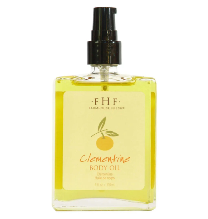 A bottle of Farmhouse Fresh Clementine Body Oil on a white background.