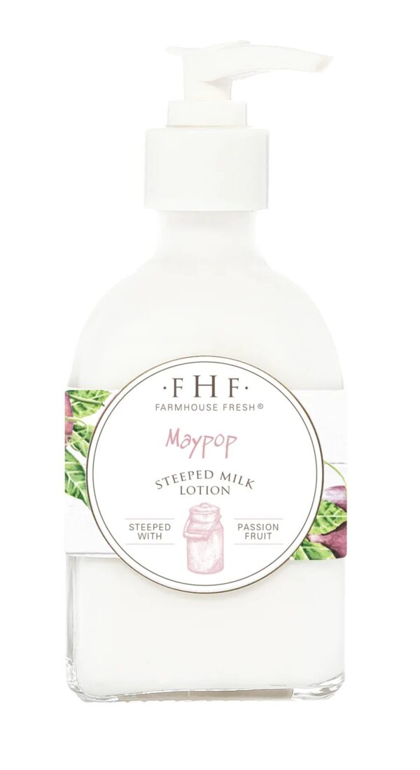 A bottle of hand lotion with a pink flower on it.