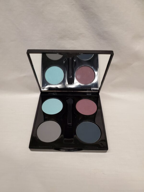 Eyeshadow palette in a black case on a white surface.