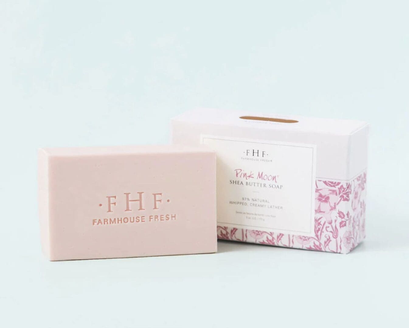 A Farmhouse Fresh Pink Moon Shea Butter Soap with a pink label.