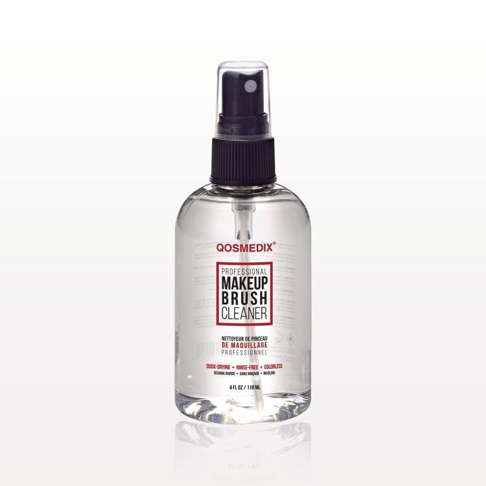 A bottle of makeup spray on a white background.