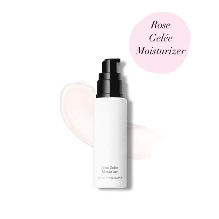 A bottle of rose coffee moisturiser on a white background.