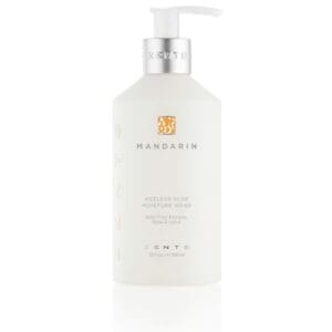 A bottle of hand and body lotion on a white background.