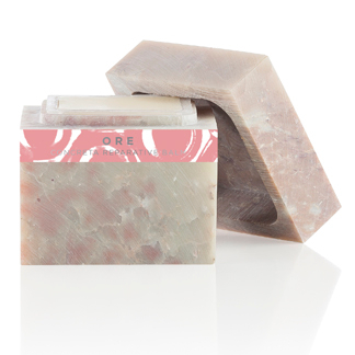 A soap bar with a pink and white design.