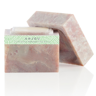 A pink soap bar with a green label.