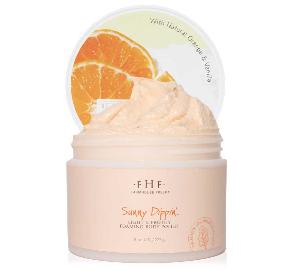 A jar of FHF Sunny Dippin' Foaming Body Polish on top of a white background.