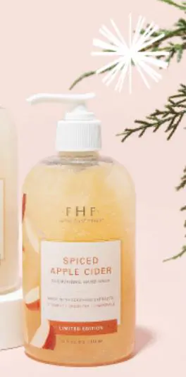 Two bottles of Farmhouse Fresh LIMITED Holiday Hand & Body Wash "Spiced Apple Cider" on a white background.