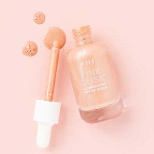 Pink Dusk Illuminating Peptide Serum bottle and drops.