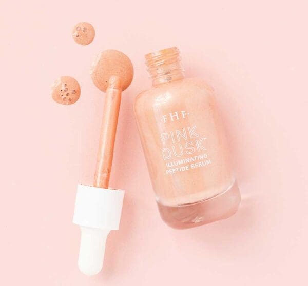 Pink Dusk Illuminating Peptide Serum bottle and drops.