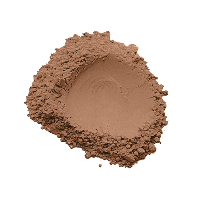 Brown cocoa powder pile on white background.